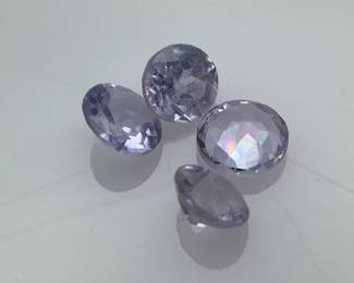 Four (4) tanzanite 2.5mm round cut gemstones. 0.18 ctw.