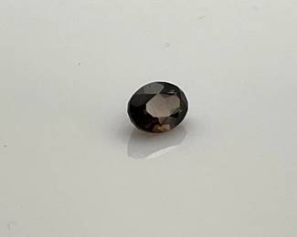 Smoky quartz oval cut gemstone. 8mm x 6mm. 1.25 ctw.
