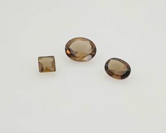 Smokey quartz gemstones, mixed shapes and sizes. 3.75 ctw.