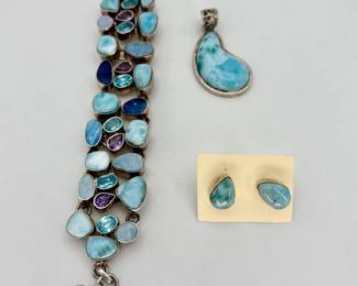 1 1/2" kidney shaped Larimar pendant with 8" three strand matching bracelet. Matching teardrop post earrings.