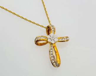 Gold plated sterling silver (stamped 925) cross pendant with diamond accents on an 18" gold plated silver chain (stamped 925).