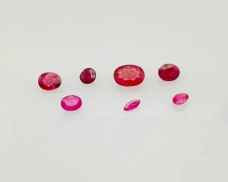 Seven (7) pink topaz oval cut gemstones, assorted sizes. 2.70 ctw.
