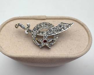 Vintage Shriners rhinestone crescent moon and scimitar sword 1 1/2" pin. Silver tone.