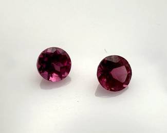 Two (2) rhodolite 4mm round cut garnet gemstones. 0.62 ctw.