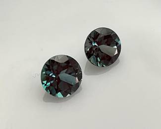 Two (2) round cut 6mm alexandrite gemstones. 1.5 ctw.
