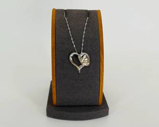 The Bradford Exchange "Messenger From Heaven" Butterfly Heart Pendant Necklace. Sterling silver heart pendant with 18K gold plating. A mother of pearl inlay butterfly sits within the heart. 1" pendant, 18" silver singapore chain. 5.21 gtw.