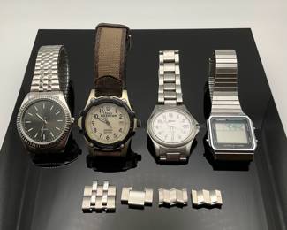 Four (4) watches. Timex Expedition with canvas band. Casio World Time Digital. Bolair silver tone and unmarked Quartz with silver tone elastic band. Unknown working condition.