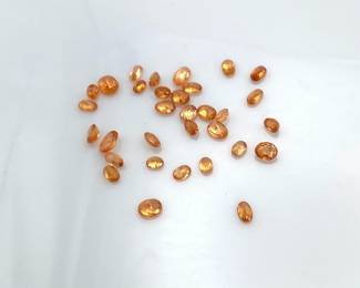 Spessartite garnet oval cut gemstones. Mixed sizes. 20 ctw.