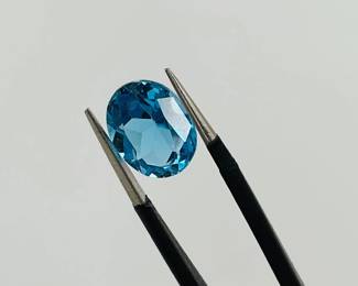 Blue Tourmaline oval cut gemstone. 9.9mm x 7.9mm. 3.05 ctw.