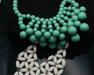 Two (2) apron style beaded fashion necklaces. (1) is mint green and (1) white.