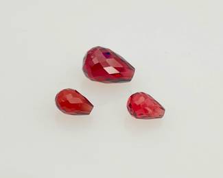 Three (3) red tourmaline teardrop shaped gemstones. (1) larger and (2) smaller. 5.25 ctw.