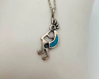 Sterling silver with inlaid turquoise kokopelli pendant on an 18" silver chain (stamped .925)
