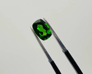 Chrome Diopside 7mm x 5mm dark green emerald cut gemstone. 0.55 ctw.