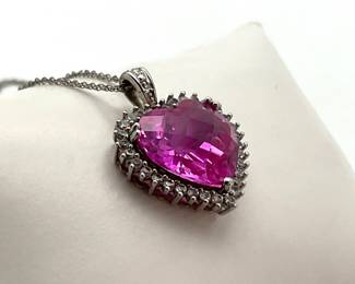 Pink topaz heart pendant on an 18" .925 silver chain. 5.48 gtw.