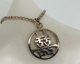 Sterling Silver 26" necklace with 1" round pendant with Asian design. Both chain and pendant stamped 925. 16.95 gtw