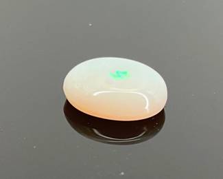 Opal oval cut cabochon. 8.2mm x 10mm. 2.0 ctw.