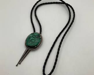 Leather Bolo Tie with Malachite Slide. Stone has some breaks and scratches in it.