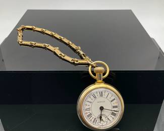 Westclox Conductor gold tone pocket watch, circa 1970s. Engraved train on the back. Unknown working condition.