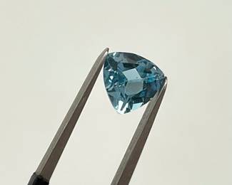 Trillion cut swiss blue topaz gemstone. 6mm x 6mm. 0.90 ctw.