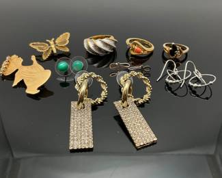 Three (3) gold plated fashion rings, "18K HGE" size 4, 6 and 6.25. Monet gold tone butterfly pin, Uyn Uyn rhinestone earrings and more.