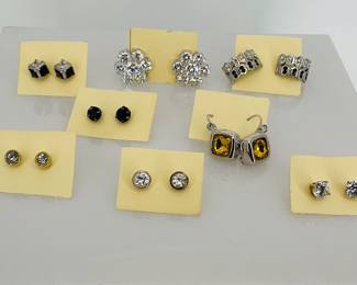 Eight (8) pairs of rhinestone earrings. Most clear, some black and (1) yellow. (4) post back and (3) hinge back.