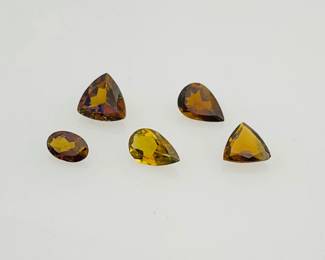 Five (5) tourmaline gemstones in shades of brown. Mixed sizes and shapes. 1.90 ctw.