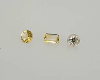 Three (3) light colored citrine gemstones. Various shapes and sizes. 1.8 ctw.