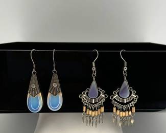 Moonstone and silver (stamped 925) dangle fish hook earrings and blue agate dangle earrings.