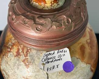 M54 - $85. Signed Bob "Hasselle" Raku Pottery Urn. Measures 9" wide x 18.5" tall. 