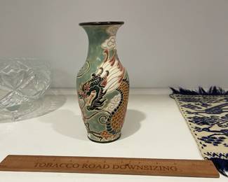 K17 - $15. Glazed Chinese Vase with Dragon Motif. Measures 8" tall. 