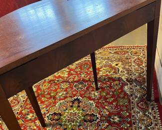 M24 - $60. Demilune Table. Measures 36" wide x 20.5" deep x 29.5" tall. Needs cleaned up/ refinished but it's sturdy, solid wood. 