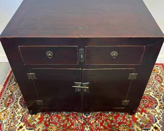 M48 - $450. Two Door, Two Drawer Red Asian Chest. Measures 41" wide x 25.5" deep x 35.75" tall. 