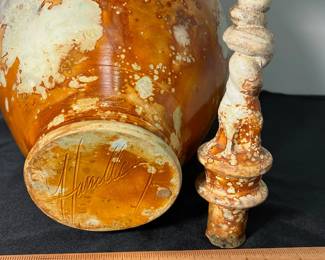 M54 - $85. Signed Bob "Hasselle" Raku Pottery Urn. Measures 9" wide x 18.5" tall. 