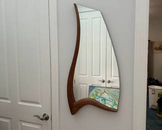K69 - $150. Vintage Asymmetrical Wood Framed Mirror. Measures 18" wide x 37" tall. Wood frame is in excellent condition - mirror shows a bit of wear along the edge. 