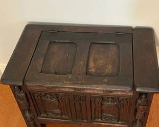 M138 - $275. Gothic Revival Small Chest with Carved Knight Figures. Measures 24.5" wide x 15" deep x 18" tall. 