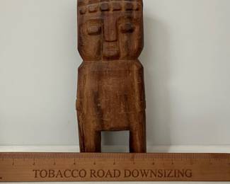 K31 - $12. Carved wooden figure from Peru. Measures 3.5" wide x 9.5" tall. 