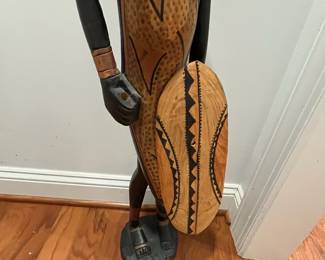 K23 - $50. Hand Carved in Kenya Statue. Measures 6.5" wide x 36.26" tall. (He was holding a sword originally but that has broken off at some point.)