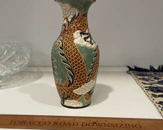 K17 - $15. Glazed Chinese Vase with Dragon Motif. Measures 8" tall. 