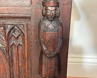 M138 - $275. Gothic Revival Small Chest with Carved Knight Figures. Measures 24.5" wide x 15" deep x 18" tall. 