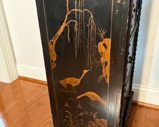 M139 - $225. Small Antique Black Lacquered Chinoiserie Cabinet - 4 drawer chest. Sides are painted in gold with a bird / water scene. Measures 17" wide x 11.5" deep x 35" tall. All drawers slide easily. 