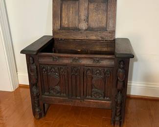 M138 - $275. Gothic Revival Small Chest with Carved Knight Figures. Measures 24.5" wide x 15" deep x 18" tall. 