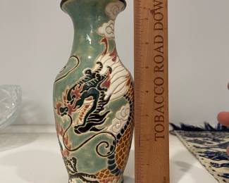 K17 - $15. Glazed Chinese Vase with Dragon Motif. Measures 8" tall. 
