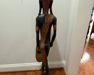 K23 - $50. Hand Carved in Kenya Statue. Measures 6.5" wide x 36.26" tall. (He was holding a sword originally but that has broken off at some point.)