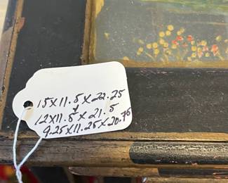 M2 - $125. Set of 3 Antique Nesting Tables. Largest measures 15" wide x 11.5" deep x 22.25" tall. The glass in the smallest table is heavily cracked. Tables are antique and wiggly. 