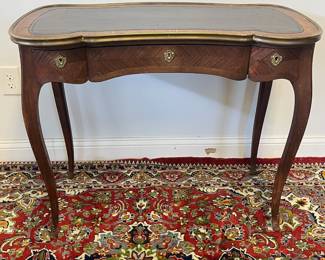 M3 - $275. Antique Leather Top Writing Desk or Vanity. Measures 35.35" wide x 17.5" deep x 28.5" tall. Has 3 drawers that would lock (no key!) Veneer is in good condition overall but does have a few missing pieces here and there. 