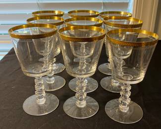 M90 - $30. Tiffin Glasses 6" tall. 9 pieces included. All have wear on gold trim. 
