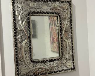 K20 - $50. Mexican Folk Art Punched Tin Mirror. Measures 17" x 21". 