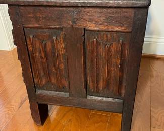 M138 - $275. Gothic Revival Small Chest with Carved Knight Figures. Measures 24.5" wide x 15" deep x 18" tall. 