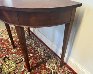 M24 - $60. Demilune Table. Measures 36" wide x 20.5" deep x 29.5" tall. Needs cleaned up/ refinished but it's sturdy, solid wood. 