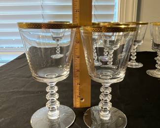 M90 - $30. Tiffin Glasses 6" tall. 9 pieces included. All have wear on gold trim. 